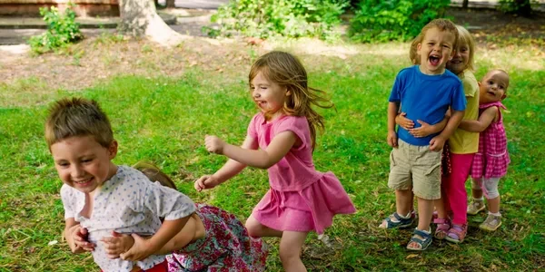 Children playing and laughing outdoors