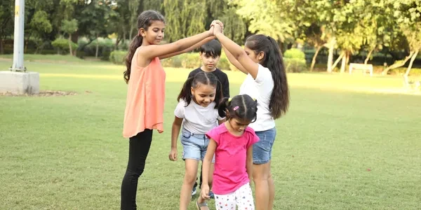 Happy kids playing together outdoors.